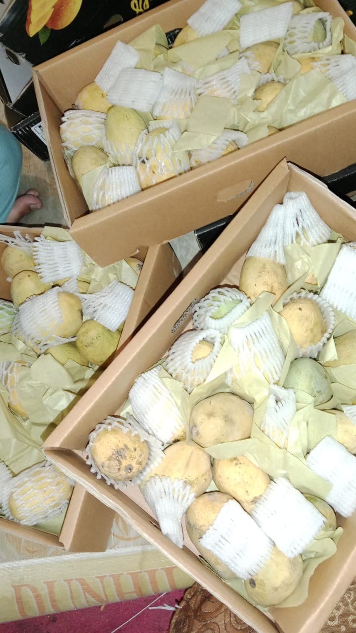 Fruit boxes packed for courier delivery